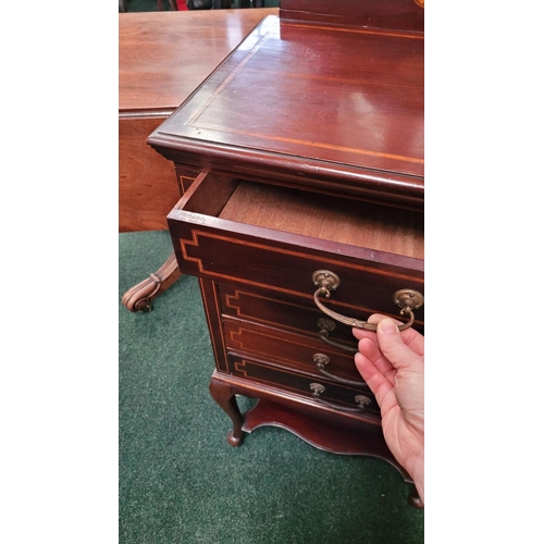 44 - AN EDWARDIAN MAHOGANY & SATINWOOD INLAID MUSIC CABINET, with 5 drop front drawers each with a swing ... 