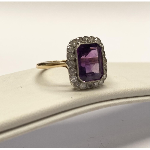 5 - A STUNNING AMETHYST AND DIAMOND CLUSTER RING, beautiful emerald cut amethyst surrounded by 20 round ... 