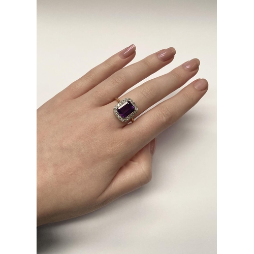 5 - A STUNNING AMETHYST AND DIAMOND CLUSTER RING, beautiful emerald cut amethyst surrounded by 20 round ... 