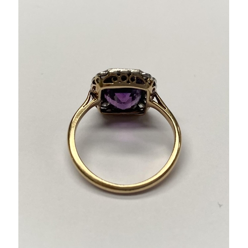 5 - A STUNNING AMETHYST AND DIAMOND CLUSTER RING, beautiful emerald cut amethyst surrounded by 20 round ... 