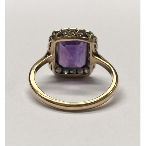 5 - A STUNNING AMETHYST AND DIAMOND CLUSTER RING, beautiful emerald cut amethyst surrounded by 20 round ... 