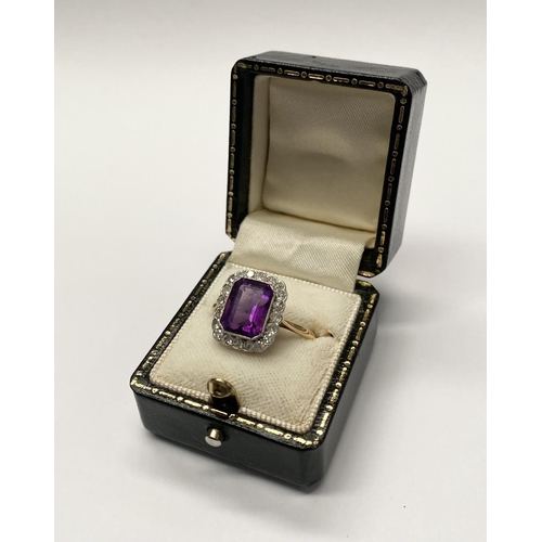 5 - A STUNNING AMETHYST AND DIAMOND CLUSTER RING, beautiful emerald cut amethyst surrounded by 20 round ... 