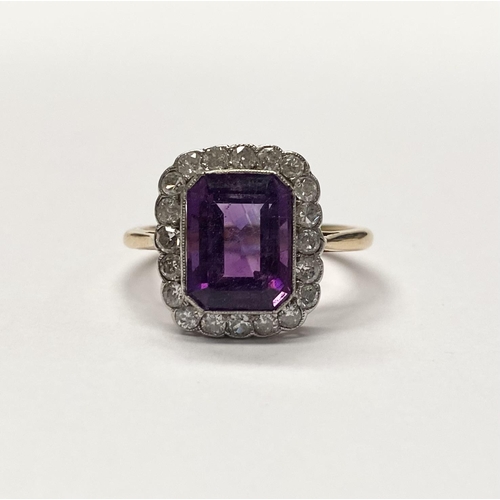 5 - A STUNNING AMETHYST AND DIAMOND CLUSTER RING, beautiful emerald cut amethyst surrounded by 20 round ... 