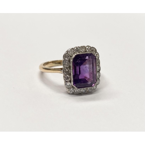 5 - A STUNNING AMETHYST AND DIAMOND CLUSTER RING, beautiful emerald cut amethyst surrounded by 20 round ... 