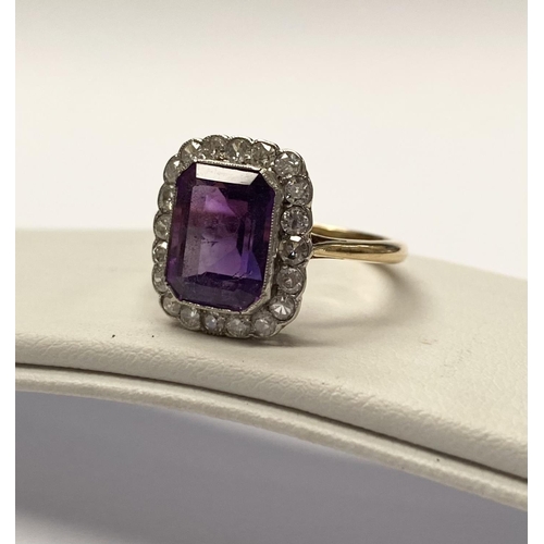 5 - A STUNNING AMETHYST AND DIAMOND CLUSTER RING, beautiful emerald cut amethyst surrounded by 20 round ... 