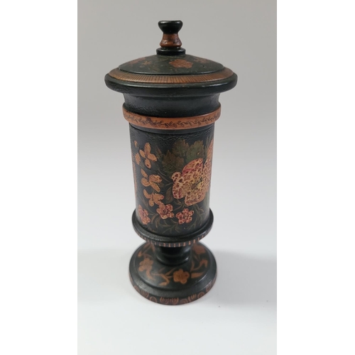 52 - A TURNED LAQUERED WOODEN TRINKET COLUMN BOX, with lift away lid, decorated all over with floral deta... 