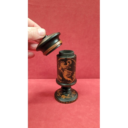 52 - A TURNED LAQUERED WOODEN TRINKET COLUMN BOX, with lift away lid, decorated all over with floral deta... 