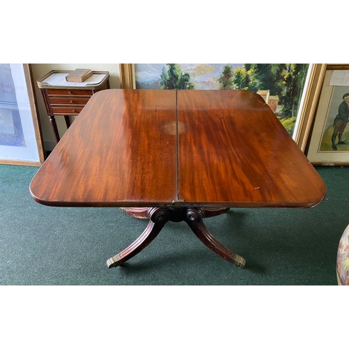 56 - A REGENCY MAHOGANY FOLD-OVER TEA TABLE, with raised carving and beading to the frieze above turned a... 