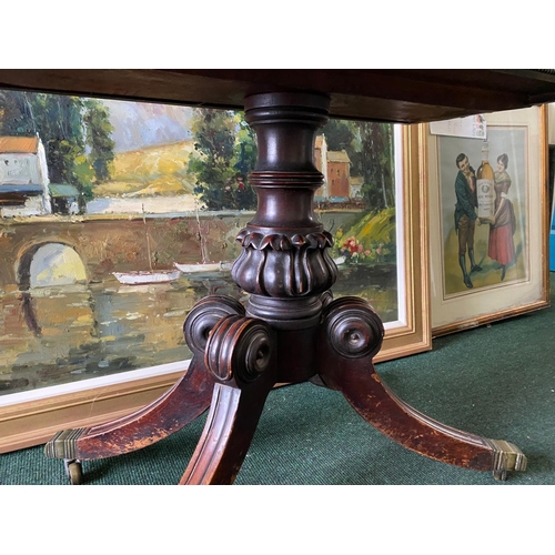 56 - A REGENCY MAHOGANY FOLD-OVER TEA TABLE, with raised carving and beading to the frieze above turned a... 