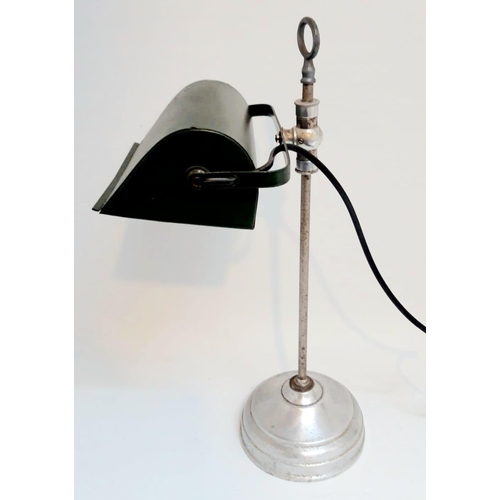 60 - AN ART DECO ADJUSTABLE DESK LAMP, with green shade. Dimensions: 42cm high and 19cm wide.