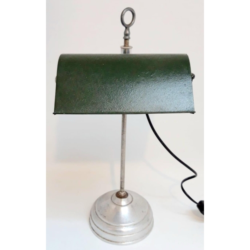 60 - AN ART DECO ADJUSTABLE DESK LAMP, with green shade. Dimensions: 42cm high and 19cm wide.