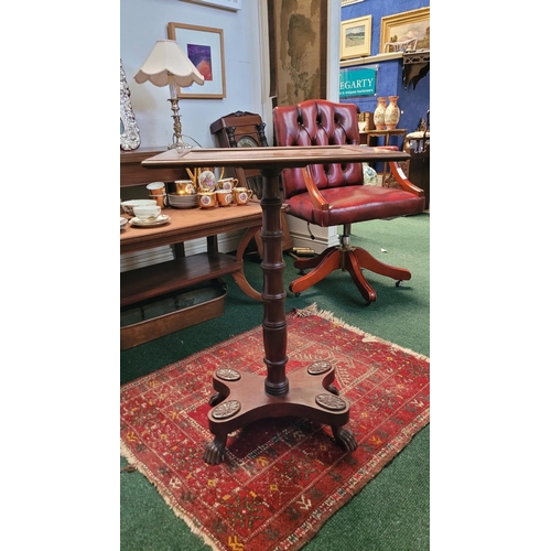 65 - A REGENCY STYLE ROSEWOOD OCCASIONAL TABLE, debossed top with shallow lip on edge, supported by a rin... 