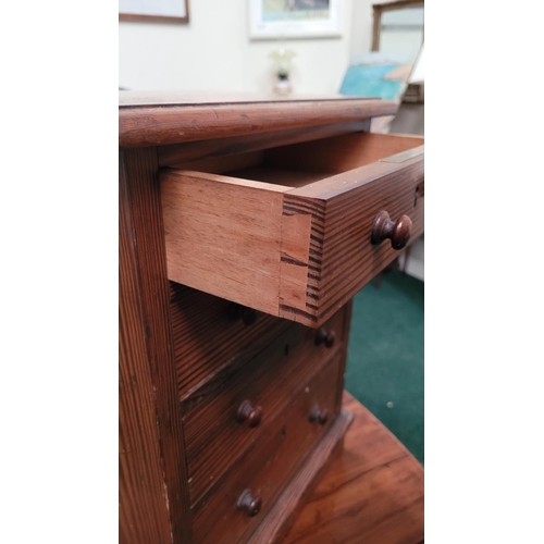 70 - A MINIATURE PINE CHEST OF DRAWERS, the hand crafted miniature chest has four drawers each with a pai... 