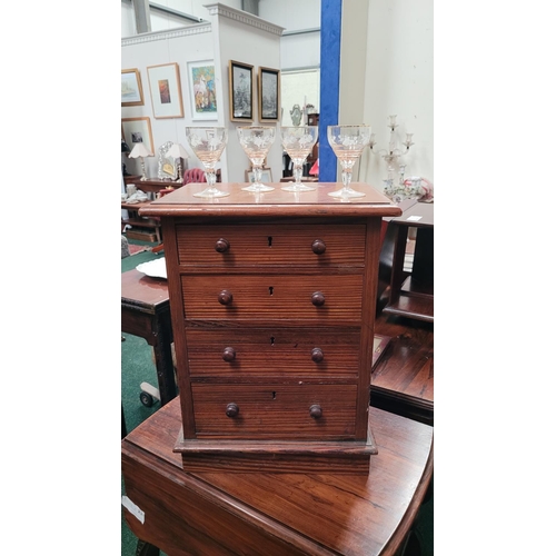 70 - A MINIATURE PINE CHEST OF DRAWERS, the hand crafted miniature chest has four drawers each with a pai... 