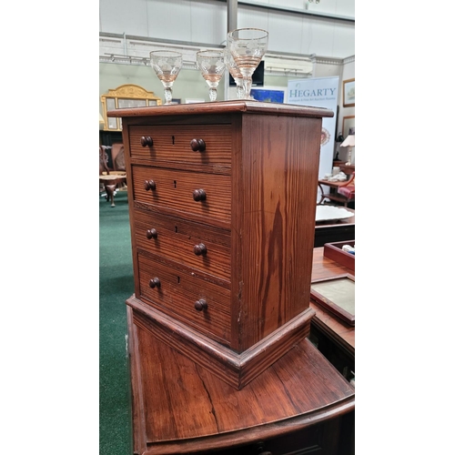 70 - A MINIATURE PINE CHEST OF DRAWERS, the hand crafted miniature chest has four drawers each with a pai... 