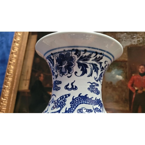 72 - A BLUE & WHITE CHINESE DRAGON VASE, with a seal mark to the base, possibly Qianlong mark. Of Baluste... 