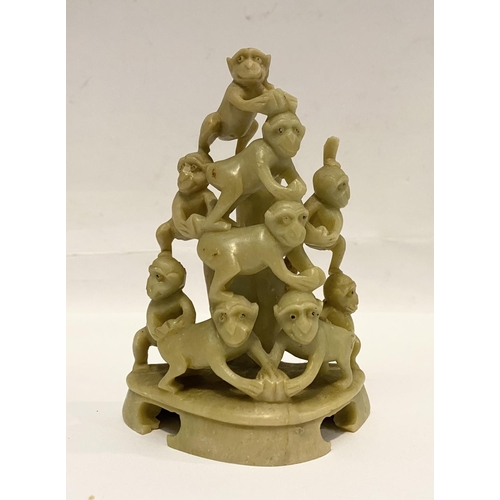 78 - A LATE 19TH CENTURY CHINESE SOAPSTONE CARVING, of a group of monkeys forming a pyramid, light yellow... 