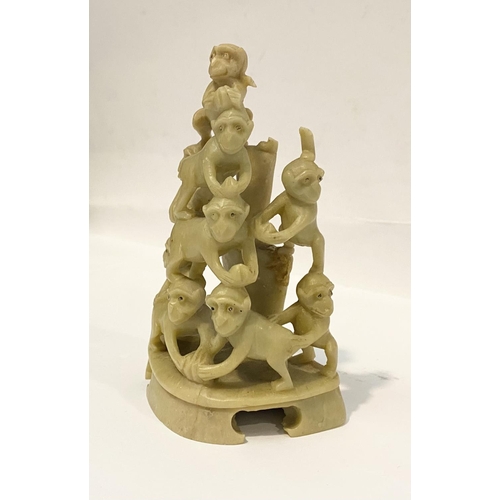 78 - A LATE 19TH CENTURY CHINESE SOAPSTONE CARVING, of a group of monkeys forming a pyramid, light yellow... 