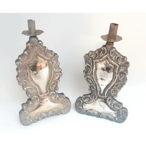 88 - AN UNUSUAL PAIR OF CANDLE SCONCE/HOLDERS, polished white metal - possibly silver plate, decorated wi... 