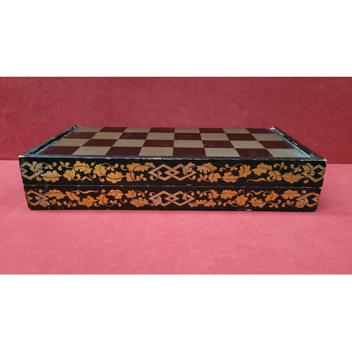 96 - AN ANTIQUE CHINESE FOLDING GAME BOX; with gilt & lacquered frame decorated with scrolling foliage de... 