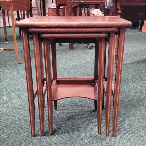 98 - A MAHOGANY & SATINWOOD INLAID NEST OF THREE TABLES, raised tapered legs, the smallest table with a s... 