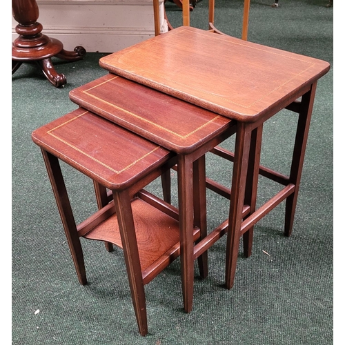 98 - A MAHOGANY & SATINWOOD INLAID NEST OF THREE TABLES, raised tapered legs, the smallest table with a s... 