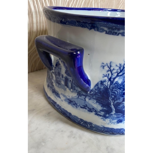 102 - A BLUE & WHITE JARDINIÉRE ‘FOOT-BATH’ PLANTER, with shaped blue handles to each end, decorated both ... 