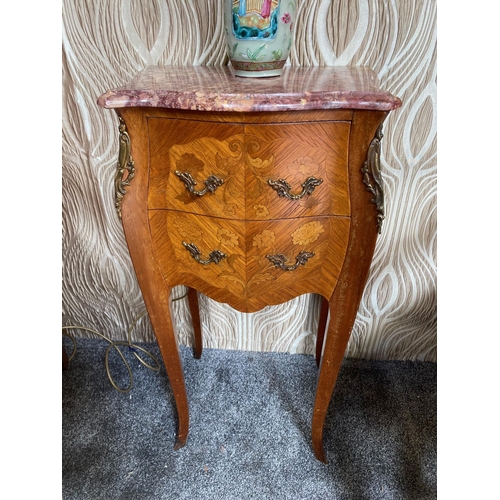 103 - A GOOD MARQUETRY INLAID BOMBE SHAPED TWO DRAWER MARBLE TOPPED CABINET / BEDSIDE / LAMP CABINET, the ... 