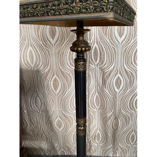 108 - A DECORATIVE METAL STANDARD LAMP, with pierced detail to the base and sitting on a brass style raise... 