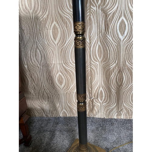 108 - A DECORATIVE METAL STANDARD LAMP, with pierced detail to the base and sitting on a brass style raise... 