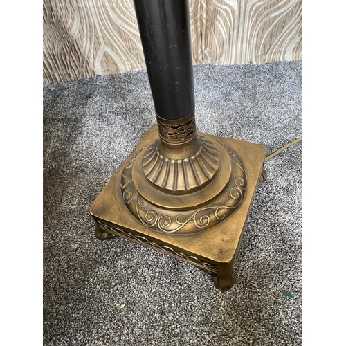 108 - A DECORATIVE METAL STANDARD LAMP, with pierced detail to the base and sitting on a brass style raise... 