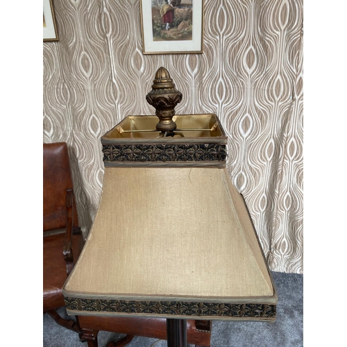 108 - A DECORATIVE METAL STANDARD LAMP, with pierced detail to the base and sitting on a brass style raise... 