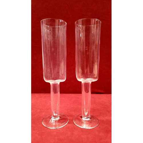 115 - A PAIR OF CAROLO MORETTI ASIMMETRICO CALICE CHAMPAGNE FLUTES, hand blown glass with etched signature... 