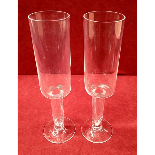 115 - A PAIR OF CAROLO MORETTI ASIMMETRICO CALICE CHAMPAGNE FLUTES, hand blown glass with etched signature... 