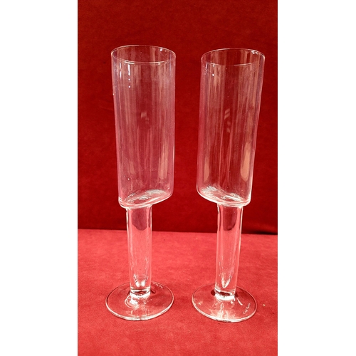 115 - A PAIR OF CAROLO MORETTI ASIMMETRICO CALICE CHAMPAGNE FLUTES, hand blown glass with etched signature... 