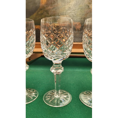 116 - A SET OF FOUR WATERFORD CRYSTAL POWERSCOURT CLARET / WINE GLASSES, each with the maker’s name to the... 