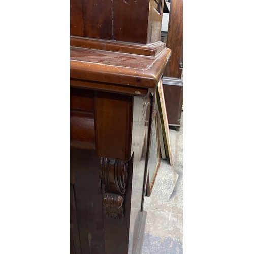 120 - A VICTORIAN MAHOGANY GLAZED BOOKCASE, with cornice above arched glass panelled doors, with carving t... 