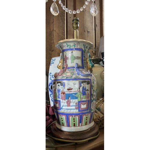 122 - A CHINESE CANTON TABLE LAMP, Chinese vase converted lamp, highly decorated with painted panels depic... 