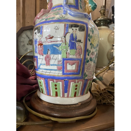 122 - A CHINESE CANTON TABLE LAMP, Chinese vase converted lamp, highly decorated with painted panels depic... 