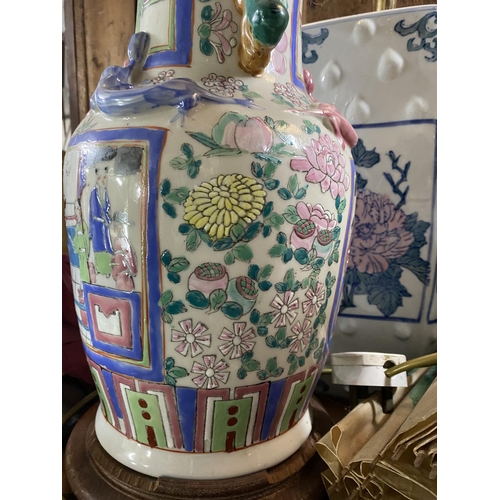 122 - A CHINESE CANTON TABLE LAMP, Chinese vase converted lamp, highly decorated with painted panels depic... 