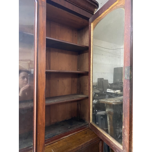 150 - A VICTORIAN MAHOGANY SECRETAIRE, with cornice above arched glass panelled doors, opening to shelved ... 