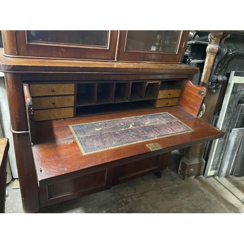 150 - A VICTORIAN MAHOGANY SECRETAIRE, with cornice above arched glass panelled doors, opening to shelved ... 