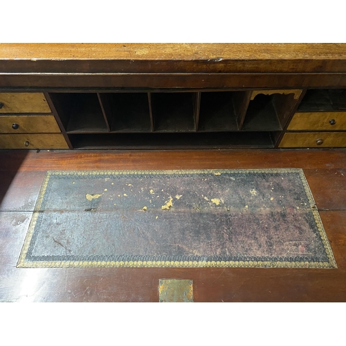 150 - A VICTORIAN MAHOGANY SECRETAIRE, with cornice above arched glass panelled doors, opening to shelved ... 