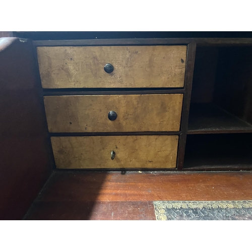 150 - A VICTORIAN MAHOGANY SECRETAIRE, with cornice above arched glass panelled doors, opening to shelved ... 