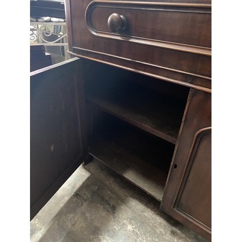 150 - A VICTORIAN MAHOGANY SECRETAIRE, with cornice above arched glass panelled doors, opening to shelved ... 