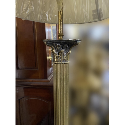 153 - A FINE BRASS FLOOR STANDARD LAMP, Corinthian column form, standing on square base on lions paw feet.... 