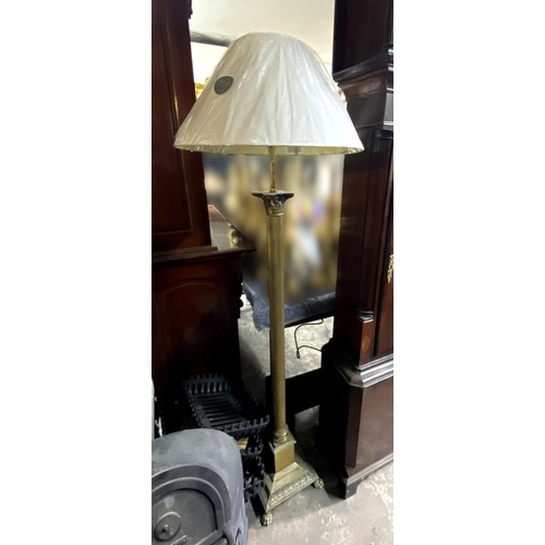 153 - A FINE BRASS FLOOR STANDARD LAMP, Corinthian column form, standing on square base on lions paw feet.... 