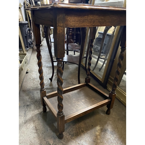 156 - AN OAK BARLEY TWIST OCCASSIONAL TABLE, with scalloped top, barley twist leg, joined by undertier sta... 