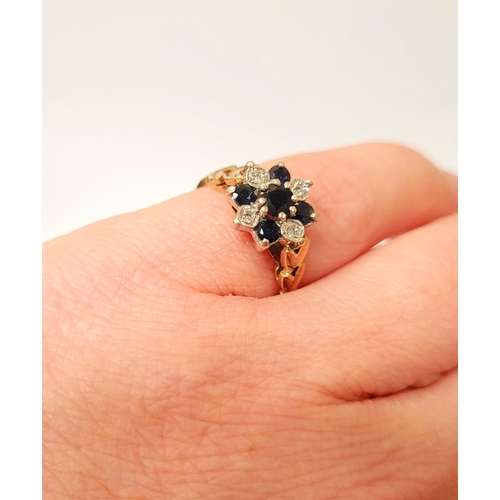 164 - A VERY PRETTY 9CT YELLOW GOLD SAPPHIRE & DIAMOND FLOWER RING, the petals in blue sapphires & small d... 