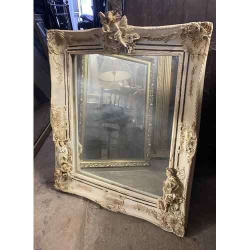 181 - A RECTANGULAR ALABASTER MIRROR, finely decorated with floral scrolling decoration as well as cherubs... 